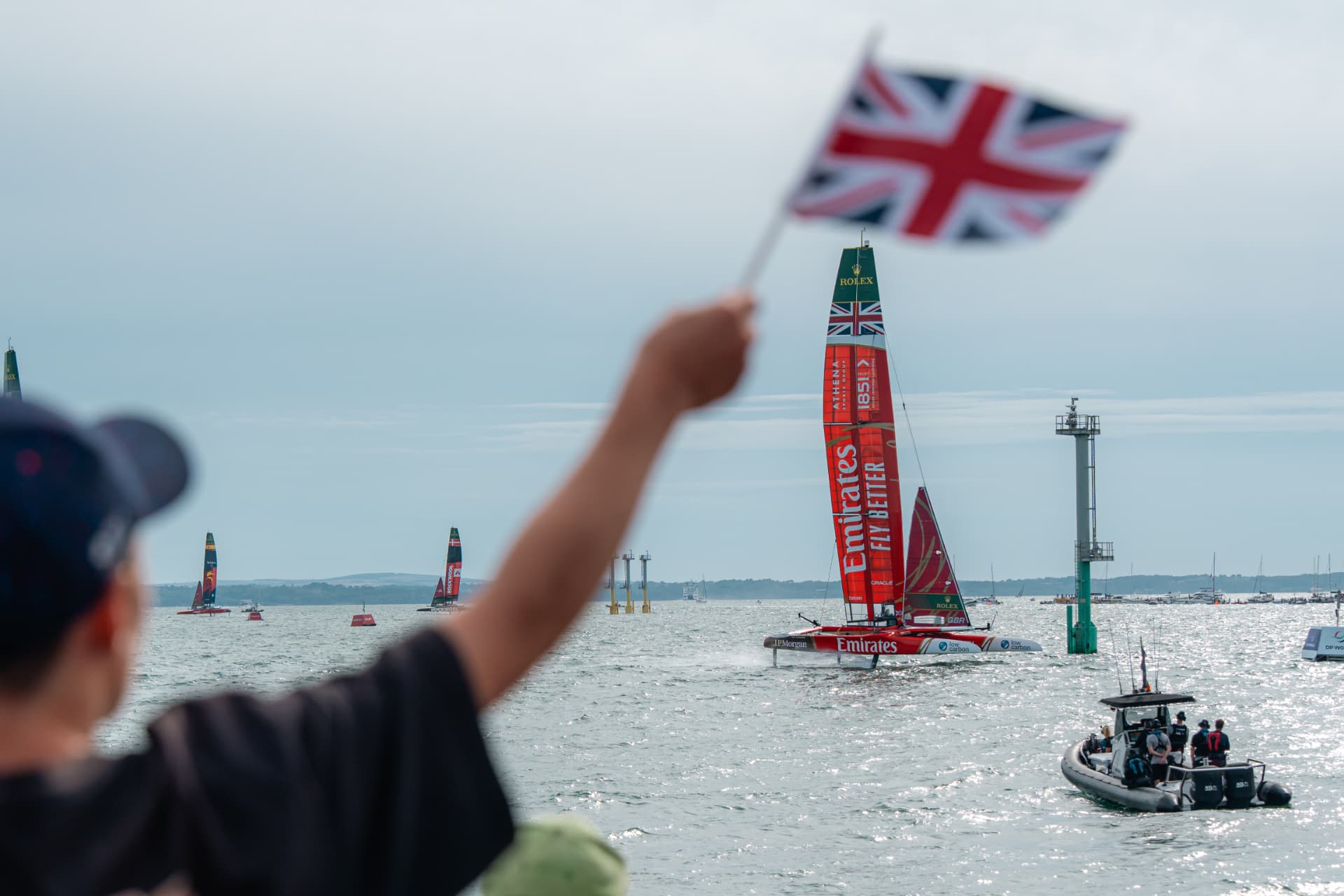 Fan waving Union Jack as Emirates GBR races past