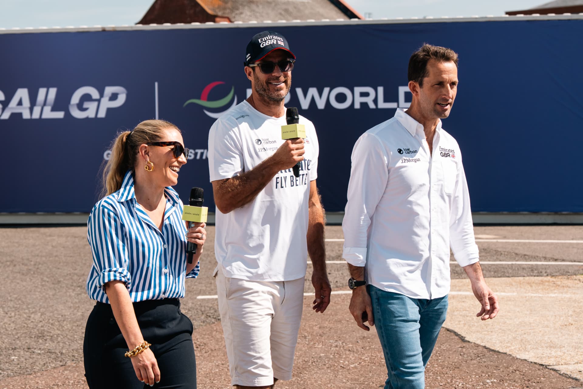 Emirates GBR team walking with mics at SailGP